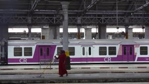 Sweepers clean the platform on Sunday, a day before the resumption of local train services in Mumbai.(Anshuman Poyrekar/HT Photo) Sweepers clean the platform on Sunday, a day before the resumption of local train services in Mumbai.(Anshuman Poyrekar/HT Photo)