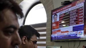 Indian stockbrokers watch the Bombay Stock Exchange (BSE) index on a trading terminal in Mumbai, India(AP) Indian stockbrokers watch the Bombay Stock Exchange (BSE) index on a trading terminal in Mumbai, India(AP)
