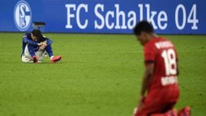Schalke's Spanish defender Juan Miranda and Leverkusen's Brazilian defender Wendell.(AP) Schalke's Spanish defender Juan Miranda and Leverkusen's Brazilian defender Wendell.(AP)