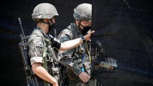 South Korean soldiers check an entrance of their guard post near the demilitarized zone separating the two Koreas in Paju, South Korea.(REUTERS) South Korean soldiers check an entrance of their guard post near the demilitarized zone separating the two Koreas in Paju, South Korea.(REUTERS)