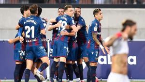Levante's players celebrate Sevilla's own goal during the Spanish League football match between Levante UD and Sevilla FC at the Ciutat de Valencia stadium in Valencia, on June 15, 2020. (Photo by JOSE JORDAN / AFP)(AFP) Levante's players celebrate Sevilla's own goal during the Spanish League football match between Levante UD and Sevilla FC at the Ciutat de Valencia stadium in Valencia, on June 15, 2020. (Photo by JOSE JORDAN / AFP)(AFP)