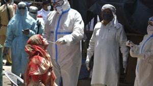 A medical worker in PPE overalls takes a swab sample for Covid-19 testing in Lucknow, Uttar Pradesh.(Dheeraj Dhawan / Hindustan Times) A medical worker in PPE overalls takes a swab sample for Covid-19 testing in Lucknow, Uttar Pradesh.(Dheeraj Dhawan / Hindustan Times)