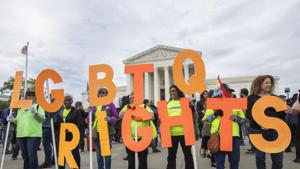 File photo of supporters of LGBTQ rights holding placards in front of the U.S. Supreme Court in Washington.(AP File) File photo of supporters of LGBTQ rights holding placards in front of the U.S. Supreme Court in Washington.(AP File)
