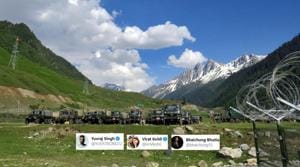 Indian army soldiers walk past their parked trucks at a makeshift transit camp before heading to Ladakh, near Baltal, southeast of Srinagar.(Reuters) Indian army soldiers walk past their parked trucks at a makeshift transit camp before heading to Ladakh, near Baltal, southeast of Srinagar.(Reuters)