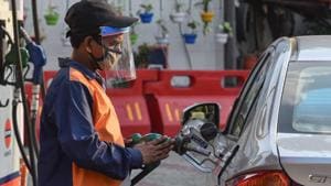 File photo: A petrol pump employee wearing a face shield while attending to a customer in Wazirpur, New Delhi.(Sanchit Khanna/HT PHOTO) File photo: A petrol pump employee wearing a face shield while attending to a customer in Wazirpur, New Delhi.(Sanchit Khanna/HT PHOTO)
