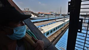 A man wearing a face masks looks at trains parked at New Delhi Railway Station (NDLS) in New Delhi.(Raj K Raj/HT PHOTO) A man wearing a face masks looks at trains parked at New Delhi Railway Station (NDLS) in New Delhi.(Raj K Raj/HT PHOTO)
