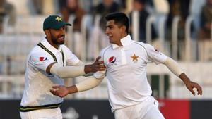 Pakistan pacer Naseem Shah, right, celebrates with teammate Shan Masood(AP) Pakistan pacer Naseem Shah, right, celebrates with teammate Shan Masood(AP)