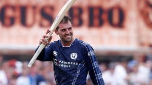 Scotland's Calum MacLeod waves as he walks off after completing their innings.(Action Images via Reuters) Scotland's Calum MacLeod waves as he walks off after completing their innings.(Action Images via Reuters)