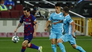 FC Barcelona's Lionel Messi, left, vies for the ball during the Spanish La Liga soccer match between FC Barcelona and Leganes at the Camp Nou stadium in Barcelona, Spain, Tuesday, June 16, 2020. (AP Photo/Joan Montfort)(AP) FC Barcelona's Lionel Messi, left, vies for the ball during the Spanish La Liga soccer match between FC Barcelona and Leganes at the Camp Nou stadium in Barcelona, Spain, Tuesday, June 16, 2020. (AP Photo/Joan Montfort)(AP)