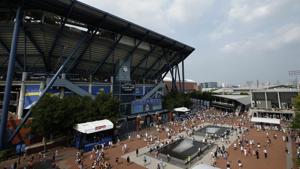 FILE - In this Aug. 27, 2018, file photo, fans walk outside of Arthur Ashe Stadium during the first round of the U.S. Open tennis tournament in New York. Governor Andrew Cuomo announced, Tuesday, June 16, 2020, that the U.S. Open will be played in Queens from Aug. 31 to Sept. 13, but without fans in attendance. (AP Photo/Jason DeCrow, File)(AP) FILE - In this Aug. 27, 2018, file photo, fans walk outside of Arthur Ashe Stadium during the first round of the U.S. Open tennis tournament in New York. Governor Andrew Cuomo announced, Tuesday, June 16, 2020, that the U.S. Open will be played in Queens from Aug. 31 to Sept. 13, but without fans in attendance. (AP Photo/Jason DeCrow, File)(AP)