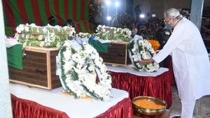 Odisha Chief Minister Naveen Patnaik paying his respects to two soldiers of 16 Bihar Regiment who were killed in Ladakh’s Galwan Valley Monday night in a clash with Chinese troops.(HT PHOTO) Odisha Chief Minister Naveen Patnaik paying his respects to two soldiers of 16 Bihar Regiment who were killed in Ladakh’s Galwan Valley Monday night in a clash with Chinese troops.(HT PHOTO)