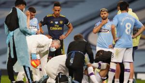 Manchester City's Eric Garcia receives medical attention after sustaining an injury as play resumes behind closed doors following the outbreak of the coronavirus disease (COVID-19).(REUTERS) Manchester City's Eric Garcia receives medical attention after sustaining an injury as play resumes behind closed doors following the outbreak of the coronavirus disease (COVID-19).(REUTERS)