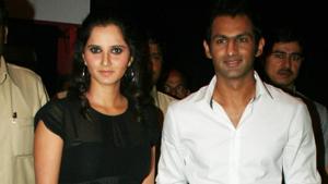 Indian tennis ace Sania Mirza and her Pakistani cricketer husband Shoaib Malik arrive for the launch of Italian fashion brand Diesel on April 29, 2010 in Mumbai, India.(Getty Images) Indian tennis ace Sania Mirza and her Pakistani cricketer husband Shoaib Malik arrive for the launch of Italian fashion brand Diesel on April 29, 2010 in Mumbai, India.(Getty Images)