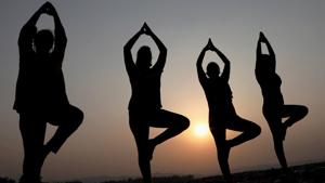 Women perform yoga during sunrise, on the outskirts in Jammu, Friday, June 19, 2020.(PTI) Women perform yoga during sunrise, on the outskirts in Jammu, Friday, June 19, 2020.(PTI)