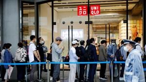 People wearing masks stand in a line to enter Uniqlo's newly launched shop in Tokyo, Japan on June 19, 2020.(Reuters Photo) People wearing masks stand in a line to enter Uniqlo's newly launched shop in Tokyo, Japan on June 19, 2020.(Reuters Photo)