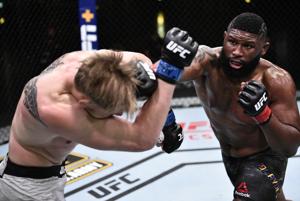 Curtis Blaydes punches Alexander Volkov of Russia in their heavyweight bout during UFC Fight Night at UFC APEX.(USA TODAY Sports) Curtis Blaydes punches Alexander Volkov of Russia in their heavyweight bout during UFC Fight Night at UFC APEX.(USA TODAY Sports)
