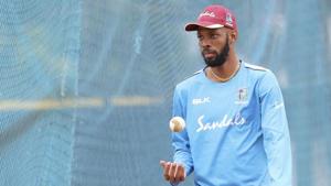 West Indies' Roston Chase tosses the ball as he prepares to bowl in the nets during a training session ahead of their first one day international cricket match against India, in Chennai.(AP) West Indies' Roston Chase tosses the ball as he prepares to bowl in the nets during a training session ahead of their first one day international cricket match against India, in Chennai.(AP)