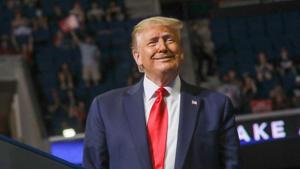 US President Donald Trump smiles at the crowd as he arrives at the podium to speak during his first re-election campaign rally in several months in the midst of the coronavirus disease outbreak, at the BOK Center in Tulsa, Oklahoma, US.(REUTERS) US President Donald Trump smiles at the crowd as he arrives at the podium to speak during his first re-election campaign rally in several months in the midst of the coronavirus disease outbreak, at the BOK Center in Tulsa, Oklahoma, US.(REUTERS)