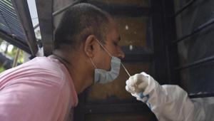 A medic collects swab sample from a man to test for Covid-19 infection at Gandhi Nagar in New Delhi on Sunday.(Sonu Mehta/HT PHOTO) A medic collects swab sample from a man to test for Covid-19 infection at Gandhi Nagar in New Delhi on Sunday.(Sonu Mehta/HT PHOTO)