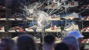 Cracks seen in a window of a retail store in Stuttgart, Germany. Police in Stuttgart say a check for drugs sparked attacks on officers and vandalism of downtown store fronts.(AP) Cracks seen in a window of a retail store in Stuttgart, Germany. Police in Stuttgart say a check for drugs sparked attacks on officers and vandalism of downtown store fronts.(AP)