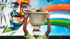 A labourer works at the MGR central railway station after the government eased a nationwide lockdown imposed as a preventive measure against the COVID-19 coronavirus, in Chennai on June 18, 2020. - The epidemic has badly hit India's densely populated major cities and Chennai in the south has ordered a new lockdown from June 19 because of a surge in cases. (Photo by Arun SANKAR / AFP)(AFP photo) A labourer works at the MGR central railway station after the government eased a nationwide lockdown imposed as a preventive measure against the COVID-19 coronavirus, in Chennai on June 18, 2020. - The epidemic has badly hit India's densely populated major cities and Chennai in the south has ordered a new lockdown from June 19 because of a surge in cases. (Photo by Arun SANKAR / AFP)(AFP photo)