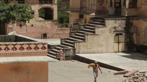 A priest walk through the courtyard of the Galtaji temple on a hot summer day, in Jaipur, Rajasthan.(Himanshu Vyas/ Hindustan Times) A priest walk through the courtyard of the Galtaji temple on a hot summer day, in Jaipur, Rajasthan.(Himanshu Vyas/ Hindustan Times)