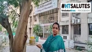 Sarita Khanchandani next to a bird feeder set up at Hiranandani College of Pharmacy, in Ulhasnagar, Maharashtra(HT Photo) Sarita Khanchandani next to a bird feeder set up at Hiranandani College of Pharmacy, in Ulhasnagar, Maharashtra(HT Photo)