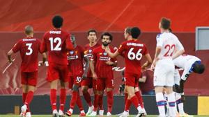Soccer Football - Premier League - Liverpool v Crystal Palace - Anfield, Liverpool, Britain - June 24, 2020 Liverpool's Mohamed Salah celebrates scoring their second goal with teammates.(REUTERS) Soccer Football - Premier League - Liverpool v Crystal Palace - Anfield, Liverpool, Britain - June 24, 2020 Liverpool's Mohamed Salah celebrates scoring their second goal with teammates.(REUTERS)