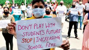 Parents protest in Chandigarh against fees charged by a private school during the lockdown period.(Ravi Kumar/HT Photo) Parents protest in Chandigarh against fees charged by a private school during the lockdown period.(Ravi Kumar/HT Photo)