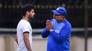 Indian bowling coach B Arun and cricketer Bhuvneshwar Kumar during a practice session ahead of the 3rd T20 match against South Africa at Chinnaswamy Stadium.(PTI)