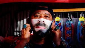 A man wears a face design mask at a traditional market to prevent the spread of the coronavirus disease (COVID-19) outbreak in Jakarta, Indonesia June 23, 2020. Picture taken June 23, 2020 REUTERS/Ajeng Dinar Ulfiana (REUTERS) A man wears a face design mask at a traditional market to prevent the spread of the coronavirus disease (COVID-19) outbreak in Jakarta, Indonesia June 23, 2020. Picture taken June 23, 2020 REUTERS/Ajeng Dinar Ulfiana (REUTERS)