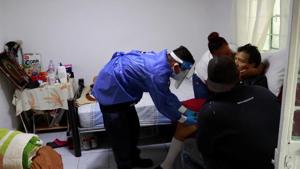 Volunteer paramedic, Kevin Garcia, checks the level of oxygen of a man with symptoms of the coronavirus disease inside a house in Nezahualcoyotl, State of Mexico, Mexico.(REUTERS) Volunteer paramedic, Kevin Garcia, checks the level of oxygen of a man with symptoms of the coronavirus disease inside a house in Nezahualcoyotl, State of Mexico, Mexico.(REUTERS)