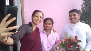 A teacher taking selfie with UP Board toppers Riya and Anurag.(HT) A teacher taking selfie with UP Board toppers Riya and Anurag.(HT)