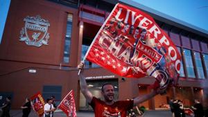 Liverpool fans celebrate winning the Premier League outside Anfield.(REUTERS) Liverpool fans celebrate winning the Premier League outside Anfield.(REUTERS)