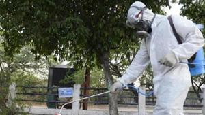A member from Disaster Response Force (DRF) of Telangana sprays disinfectant amid concerns over spike in COVID-19 cases in Hyderabad.(AFP Photo) A member from Disaster Response Force (DRF) of Telangana sprays disinfectant amid concerns over spike in COVID-19 cases in Hyderabad.(AFP Photo)