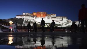 Tourists wearing face masks to protect against the new coronavirus walk along a plaza in front of the Potala Palace in Lhasa in southwestern China's Tibet Autonomous Region.(AP) Tourists wearing face masks to protect against the new coronavirus walk along a plaza in front of the Potala Palace in Lhasa in southwestern China's Tibet Autonomous Region.(AP)