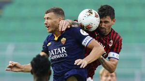 AC Milan's Alessio Romagnoli and Roma's Edin Dzeko, left, vie for the ball during the Serie A soccer match between AC Milan and Roma, at the San Siro Stadium in Milan, Sunday, June 28, 2020. (Spada/LaPresse via AP)(AP) AC Milan's Alessio Romagnoli and Roma's Edin Dzeko, left, vie for the ball during the Serie A soccer match between AC Milan and Roma, at the San Siro Stadium in Milan, Sunday, June 28, 2020. (Spada/LaPresse via AP)(AP)