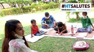 Ishita Choudhary, a student of Centre for Social Work at Panjab University seen tutoring under privileged children at Panjab University Campus in Chandigarh.(Ravi Kumar/Hindustan Times)