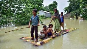 Villagers row a makeshift raft through a flooded field to reach a safer place at the flood-affected Mayong village in Morigaon district, in the northeastern state of Assam on June 29, 2020.(Reuters Photo) Villagers row a makeshift raft through a flooded field to reach a safer place at the flood-affected Mayong village in Morigaon district, in the northeastern state of Assam on June 29, 2020.(Reuters Photo)