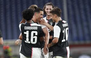 Juventus' Cristiano Ronaldo, center, celebrates after scoring a goal during an Italian Serie A soccer match between Genoa and Juventus at the Luigi Ferraris stadium in Genoa, Italy, Tuesday, June 30, 2020. (Tano Pecoraro/LaPresse via AP)(AP) Juventus' Cristiano Ronaldo, center, celebrates after scoring a goal during an Italian Serie A soccer match between Genoa and Juventus at the Luigi Ferraris stadium in Genoa, Italy, Tuesday, June 30, 2020. (Tano Pecoraro/LaPresse via AP)(AP)