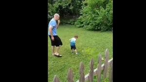 An image of the dad and son during the golf lesson.(Screengrab) An image of the dad and son during the golf lesson.(Screengrab)