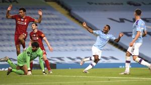 Manchester City's Raheem Sterling, second right, celebrates after his team's fourth goal during the English Premier League soccer match between Manchester City and Liverpool at Etihad Stadium in Manchester, England, Thursday, July 2, 2020.(AP) Manchester City's Raheem Sterling, second right, celebrates after his team's fourth goal during the English Premier League soccer match between Manchester City and Liverpool at Etihad Stadium in Manchester, England, Thursday, July 2, 2020.(AP)