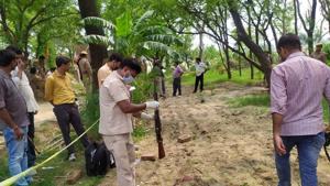 Police and forensic team members investigate the encounter site, where 8 police personnel lost their lives after being fired upon by criminals, in Kanpur.(PTI) Police and forensic team members investigate the encounter site, where 8 police personnel lost their lives after being fired upon by criminals, in Kanpur.(PTI)