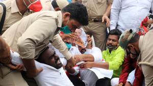 Police personnel detain Samajwadi Party supporters protesting against UP government over killing of eight policemen during an encounter with criminals, in Kanpur, in Prayagraj on Friday.(ANI Photo) Police personnel detain Samajwadi Party supporters protesting against UP government over killing of eight policemen during an encounter with criminals, in Kanpur, in Prayagraj on Friday.(ANI Photo)