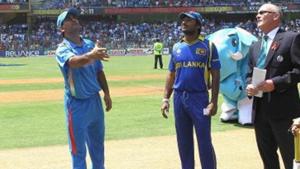 MS Dhoni tosses the coin for the second time with Kumar Sangakkara looking on during the 2011 ICC World Cup Final between India and Sri Lanka at Wankhede Stadium.(Getty Images)