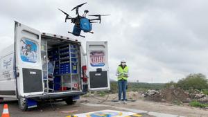 An employee of Sincronia Logistica looks at a drone loaded with personal protective gear and other essential equipment for delivery at a public hospital, in Queretaro, Mexico.(REUTERS) An employee of Sincronia Logistica looks at a drone loaded with personal protective gear and other essential equipment for delivery at a public hospital, in Queretaro, Mexico.(REUTERS)