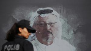 A Turkish police officer walks past a picture of slain Saudi journalist Jamal Khashoggi prior to a ceremony, near the Saudi Arabia consulate in Istanbul, marking the one-year anniversary of his death.(AP) A Turkish police officer walks past a picture of slain Saudi journalist Jamal Khashoggi prior to a ceremony, near the Saudi Arabia consulate in Istanbul, marking the one-year anniversary of his death.(AP)