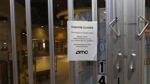A "Closed" sign is displayed outside an AMC Entertainment Holdings Inc. movie theater in Tucson, Arizona, US on Tuesday.(Bloomberg) A "Closed" sign is displayed outside an AMC Entertainment Holdings Inc. movie theater in Tucson, Arizona, US on Tuesday.(Bloomberg)