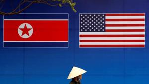 A person walks past a banner showing North Korean and U.S. flags ahead of the North Korea-U.S. summit in Hanoi, Vietnam.(REUTERS) A person walks past a banner showing North Korean and U.S. flags ahead of the North Korea-U.S. summit in Hanoi, Vietnam.(REUTERS)