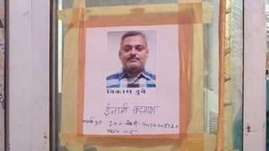 Posters seeking information about criminal Vikas Dubey, on the run since last Friday. (ANI photo) Posters seeking information about criminal Vikas Dubey, on the run since last Friday. (ANI photo)